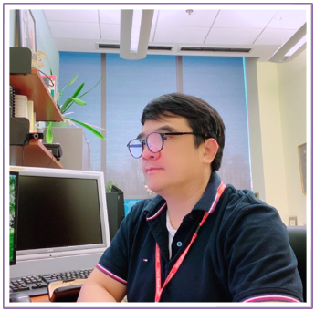 A person sitting at a desk with a computer
AI-generated content may be incorrect.